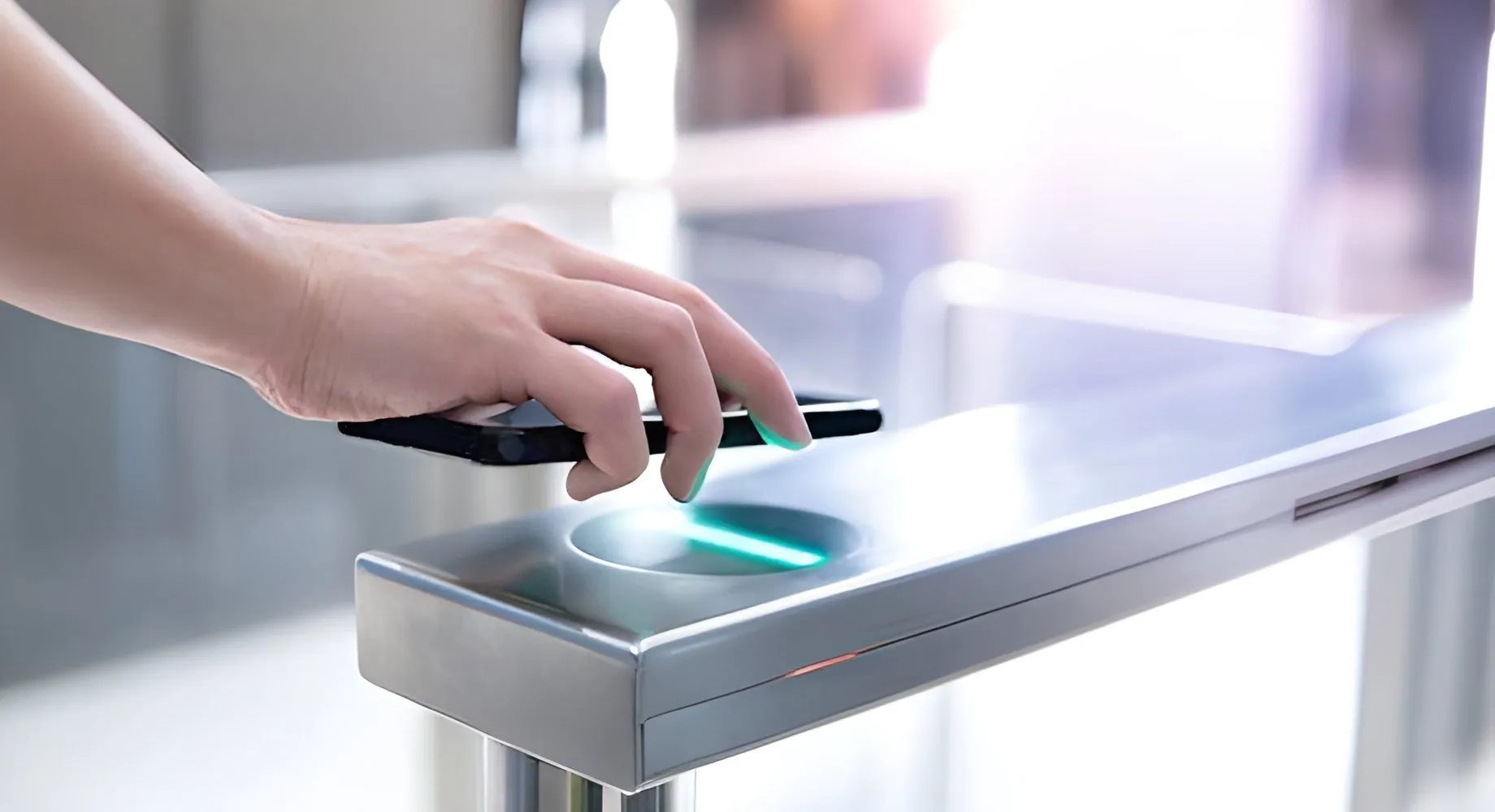 Office reception with a visitor pass reader and a glass turnstile