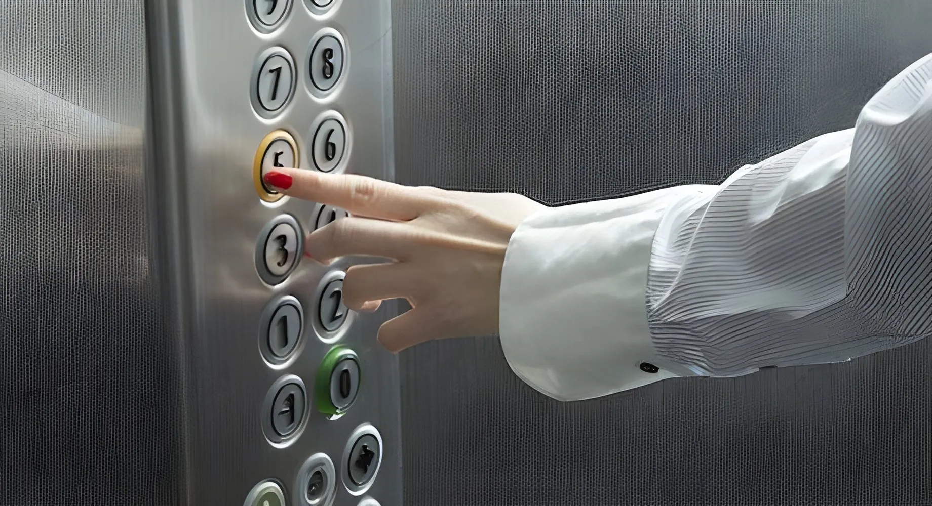 Lift lobby with a card reader beside the call button